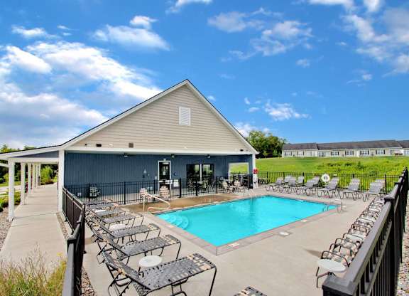 Private community pool with lounge chairs in Florence, KY