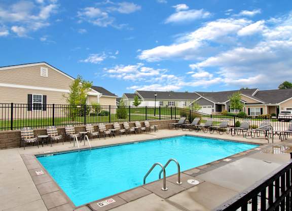 Sparkling outdoor pool with sundeck in Florence, KY rental neighborhood