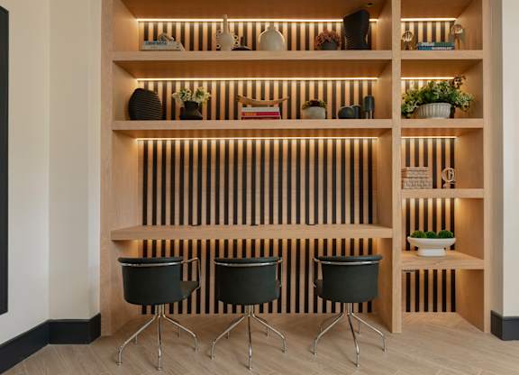 Built-in desk area with lighting and shelving at The Mews at Princeton Junction, ideal for work-from-home convenience in Princeton Junction apartments.