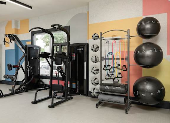 Fully equipped fitness center at The Mews at Princeton Junction featuring strength training equipment and wellness-focused amenities near Princeton Junction.