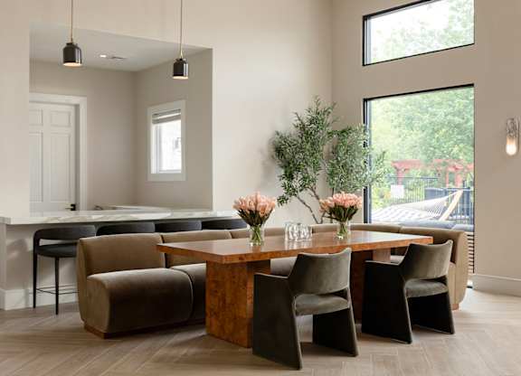 Shared conference table and collaborative amenity space at The Mews at Princeton Junction, designed for professional work and resident use.