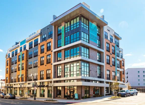 The Mint Rahway building exterior, a modern and stylish luxury apartment rental community, conveniently located near local amenities.