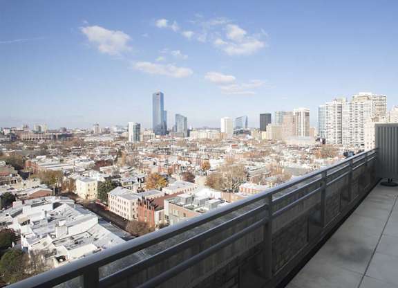 Stunning Philadelphia skyline views from the balcony of The Pepper Building, located in the heart of the Rittenhouse and Graduate Hospital neighborhoods.