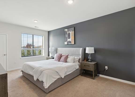 Cozy bedroom with ensuite bathroom at The Lofts at Middlesex