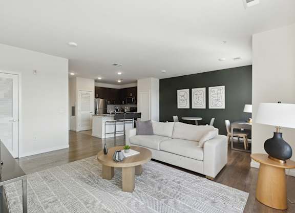 Cozy living room with couch in an apartment rental at The Lofts at Middlesex