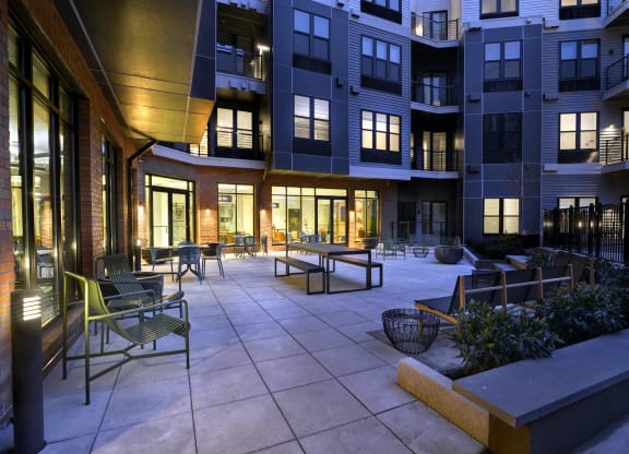 Outdoor courtyard at The Mint Rahway with seating areas, perfect for socializing, located near Rahway Train Station and Coffee Box Rahway.