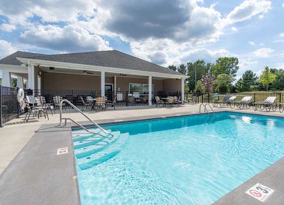 A pool with a no swimming sign on the side.