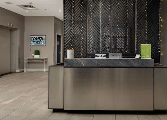 A reception desk with a green box on top of it.