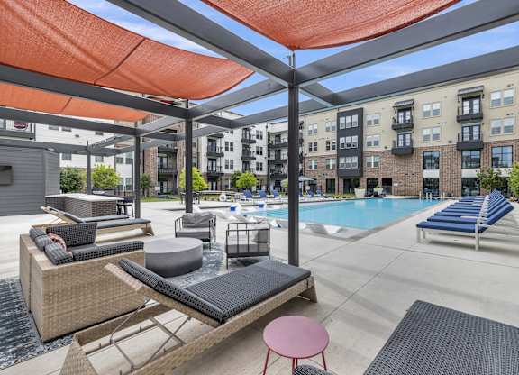 our apartments have a swimming pool with lounge chairs and umbrellas