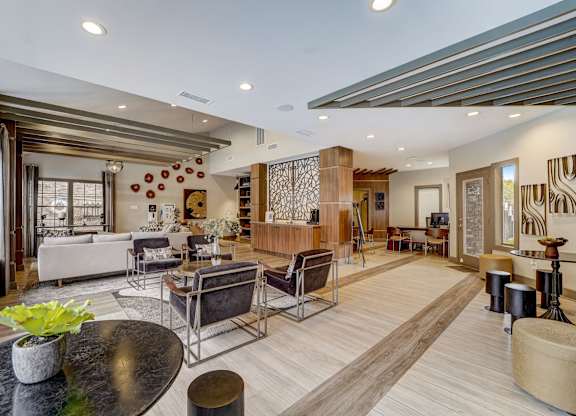 a living room with a couch and a table with chairs