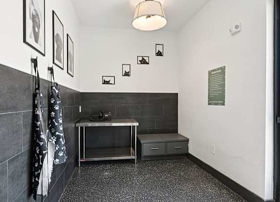 A bathroom with a sink and a towel hanging on the wall.