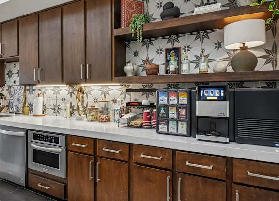A kitchen with brown cabinets and a white countertop.