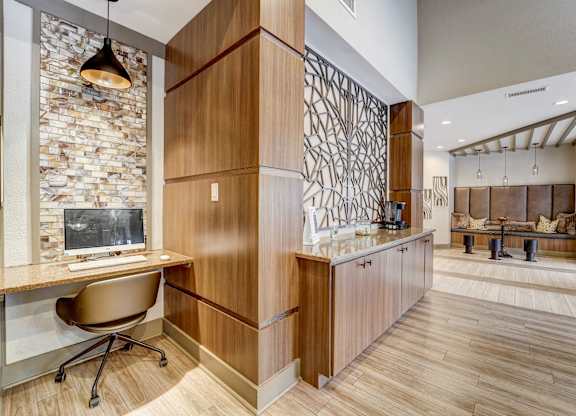 a home office with a desk and a fireplace