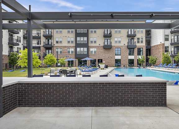 our apartments have a large pool with lounge chairs and umbrellas