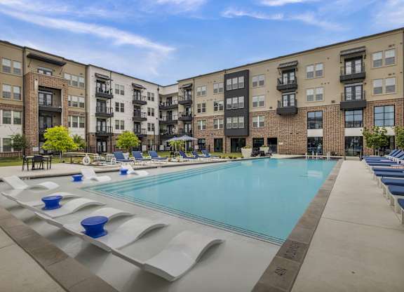 our apartments have a large swimming pool with lounge chairs