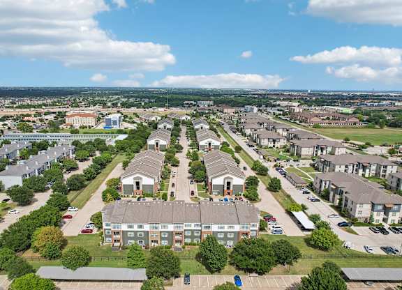 A bird's eye view of a residential area with houses and apartment buildings.