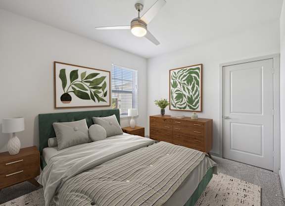 A bedroom with a bed, nightstand, and a ceiling fan.