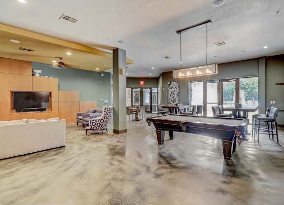 the preserve at ballantyne commons community clubhouse with a pool table