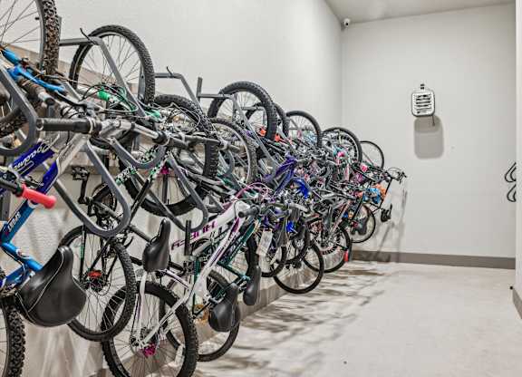 A room full of bicycles is shown.