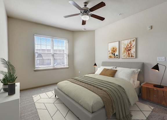a bedroom with a bed and a ceiling fan