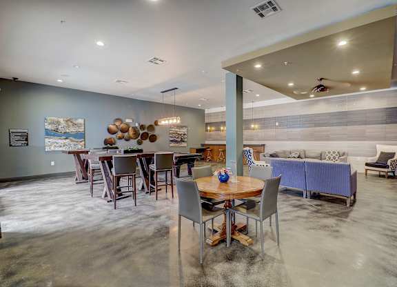 a living room with a dining room table and a couch