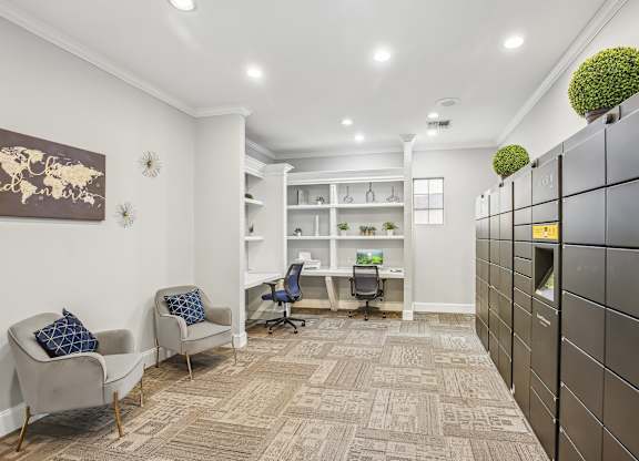 A room with a carpeted floor, a desk with a chair, and a bookshelf.