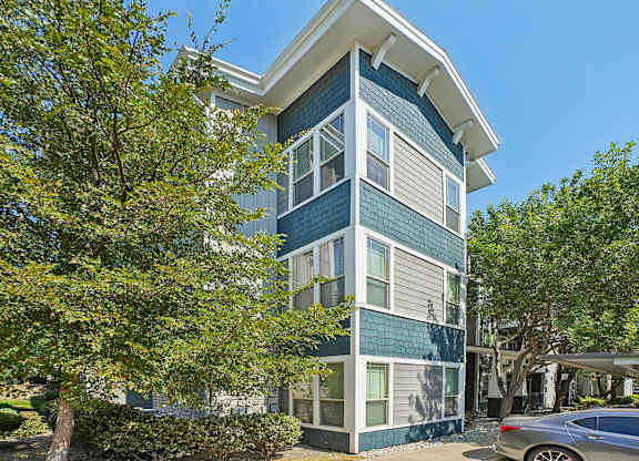A modern two-story building with a blue and white exterior.