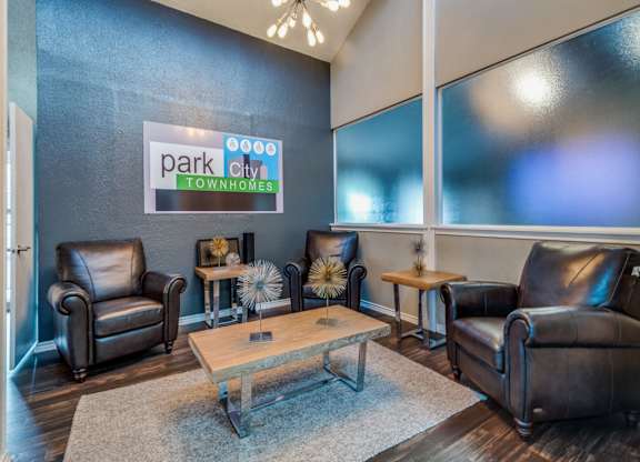 A living room with a sign that says