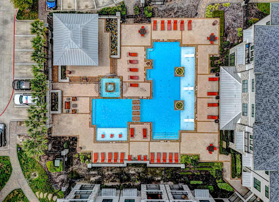 arial view of a large swimming pool in a residential yard