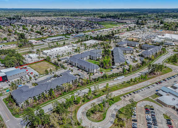 an aerial view of a city with many buildings and roads