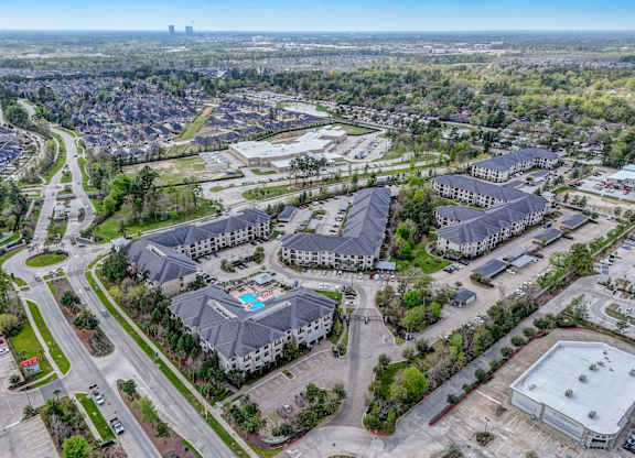 an aerial view of a city with many buildings and roads
