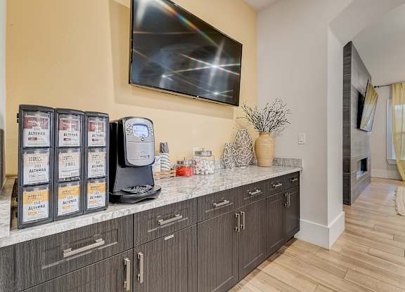 A modern kitchen with a countertop and cabinets.
