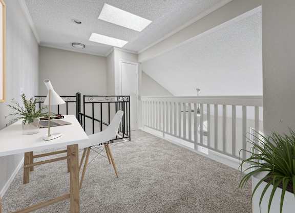 a home office with a white desk and a balcony