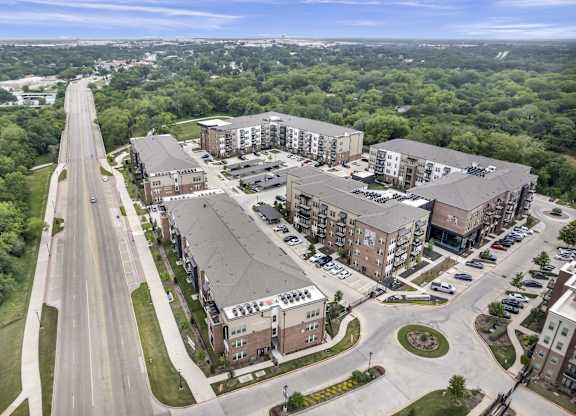 an aerial view of apartment buildings and a street