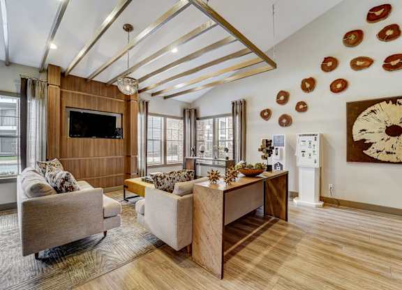 a living room with couches and a dining room table