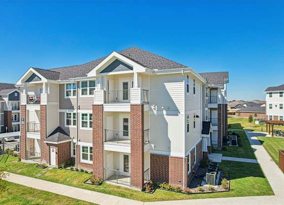 A large apartment complex with multiple buildings and balconies.