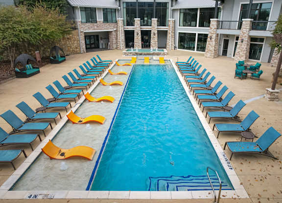an aerial view of the pool at the resort