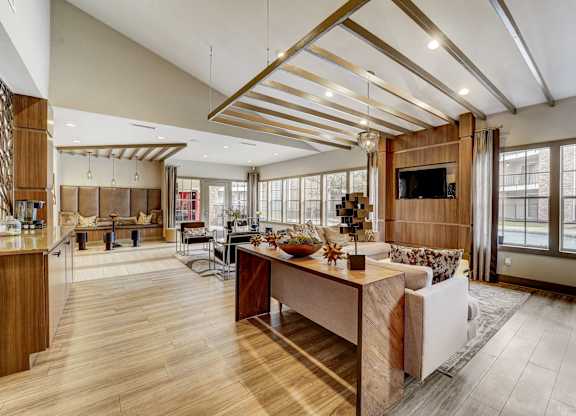 a large living room with a kitchen and a dining room