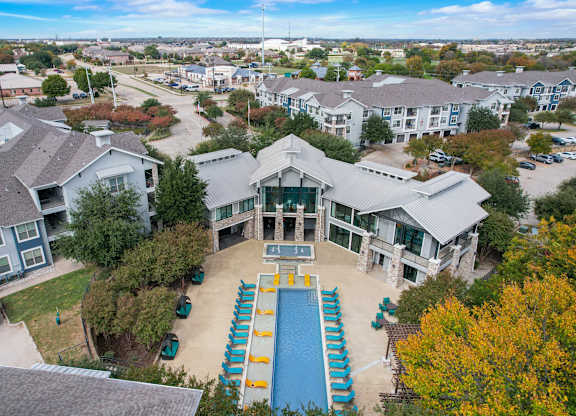 an aerial view of a house with a swimming pool