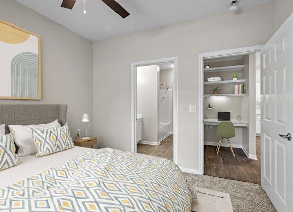 a bedroom with a large bed and a closet with a desk