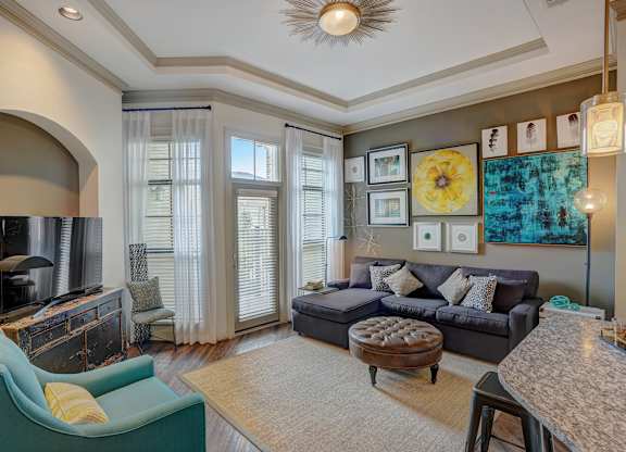 a living room with a couch and a tv