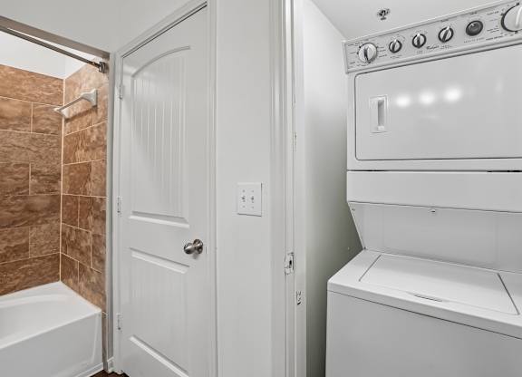 A white oven and stove top in a bathroom.