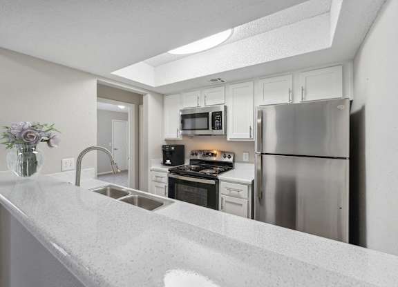 the preserve at ballantyne commons apartment kitchen with stainless steel appliances