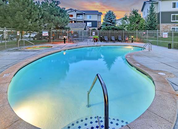 A small pool with a ladder in the middle of it.