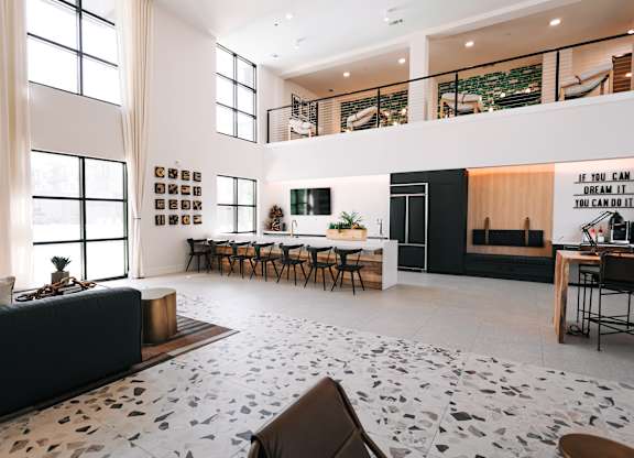 a large living room with a dining room and a kitchen