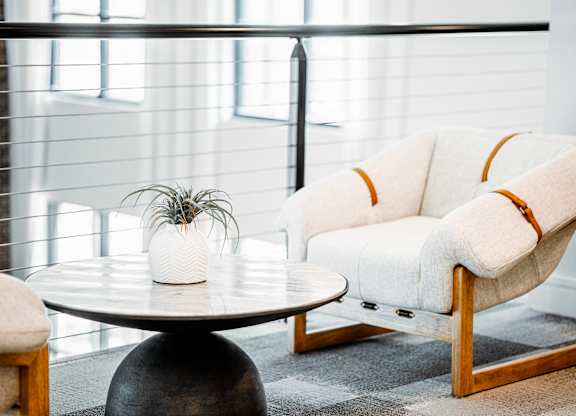 a living room with two chairs and a coffee table