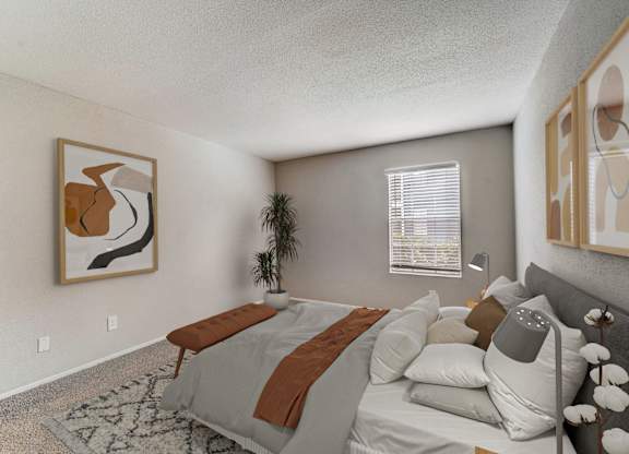 the living room of an apartment with a couch and a bed