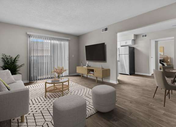 the living room of an apartment with a couch and a table