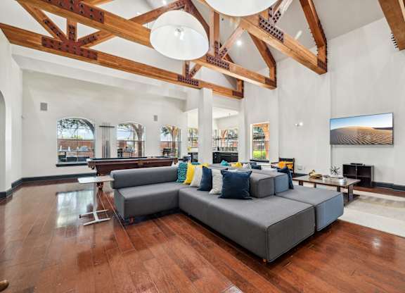 a large living room with a large couch and a table