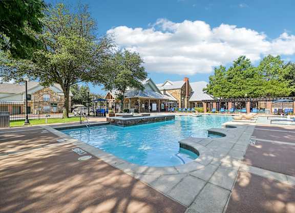 the swimming pool at the preserve at polo ridge apartments tx